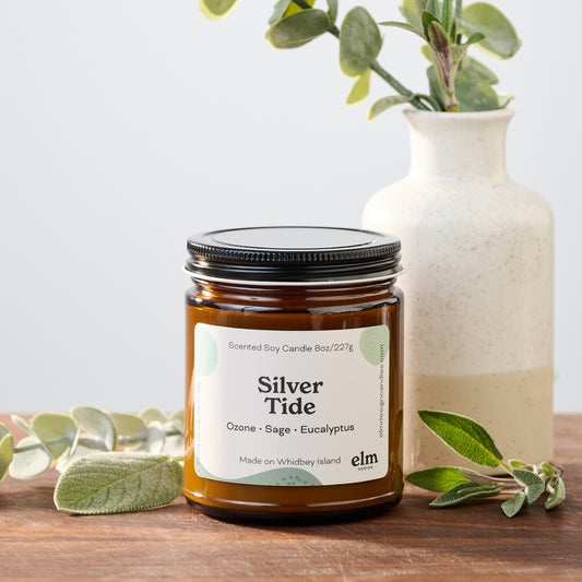 Silver Tide scented soy candle in an 8oz amber glass jar.