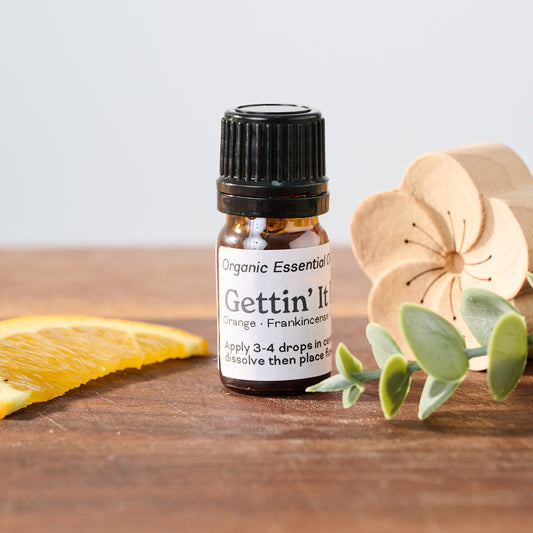 Gettin' It Done Organic Essential Oil Car Diffuser with a Beechwood Flower and Magnetic Car Vent Clip.