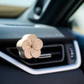 Load image into Gallery viewer, Beechwood flower diffuser clipped to car vent.