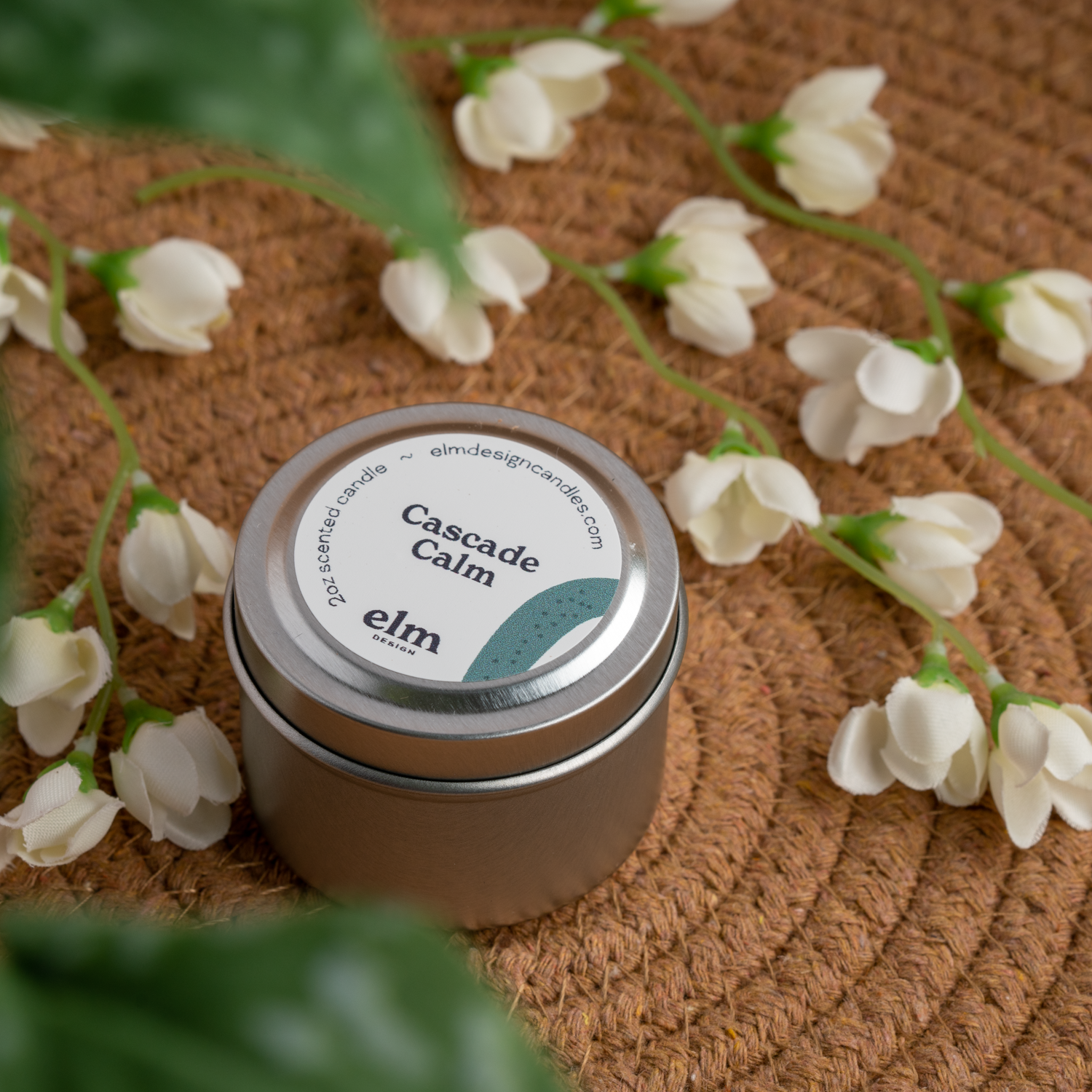 Cascade Calm scented soy candle in colorfully labeled 2 oz container.