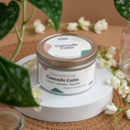 Load image into Gallery viewer, Cascade Calm scented soy candle in colorfully labeled 6 oz container.