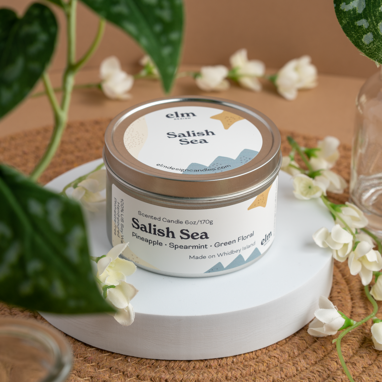 Salish Sea scented soy candle in colorfully labeled 6 oz container.