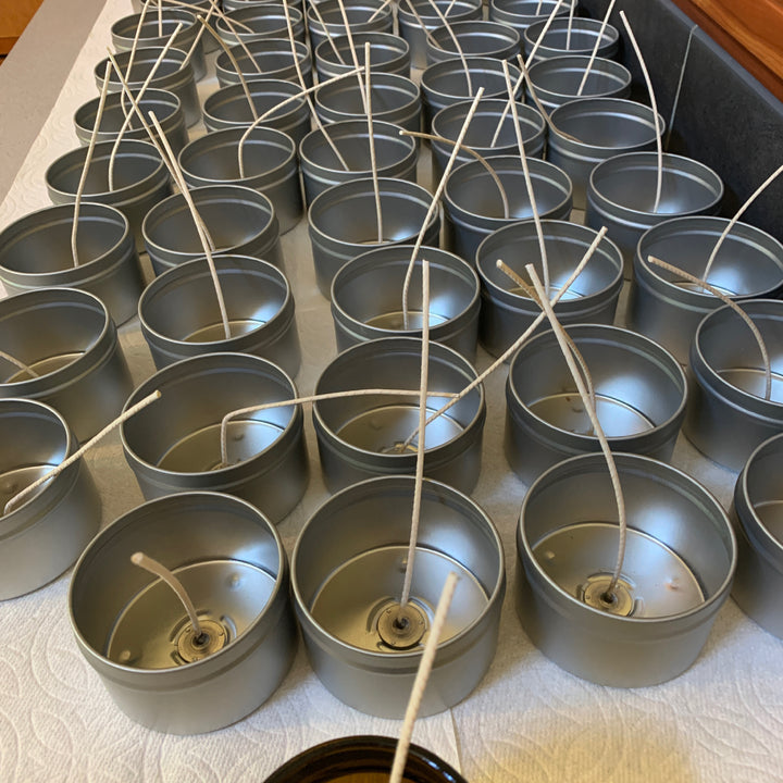 candles set up in a row and waiting to be poured