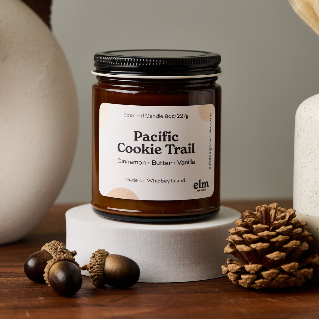 Elm Designs Pacific Cookie Trail scented candle in 8oz glass jar.