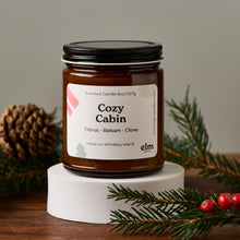 Load image into Gallery viewer, Elm Design&#39;s Cozy Cabin scented candle in an 8oz glass jar.
