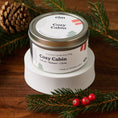 Load image into Gallery viewer, Elm Design's Cozy Cabin scented candle in an 6oz metal tin.

