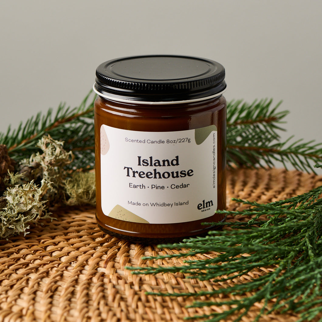 Elm Designs Island Treehouse scented candle in 8oz glass jar.