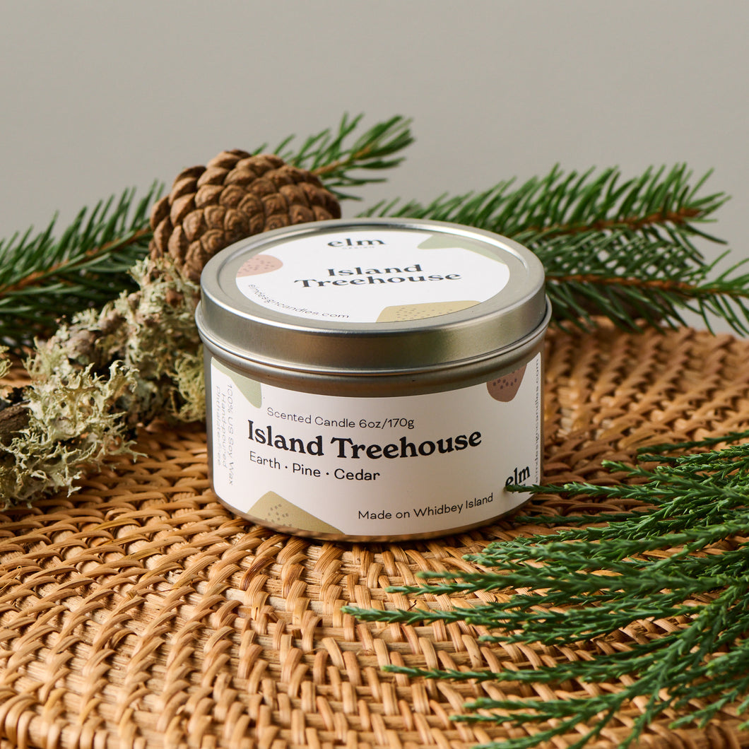Elm Designs Island Treehouse scented candle in 6oz metal tin.