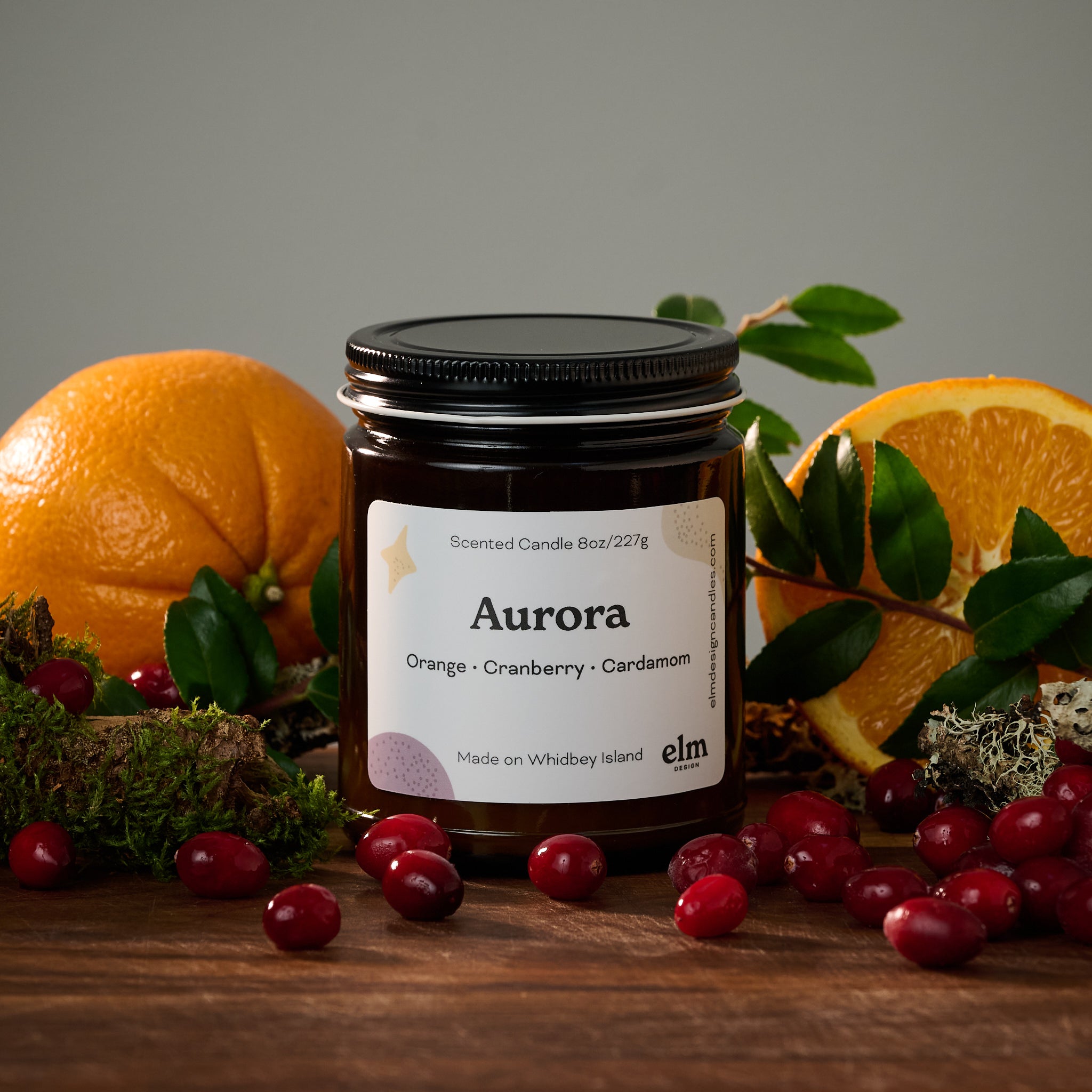 Elm Design's scented candle "Aurora" in an 8oz glass jar.