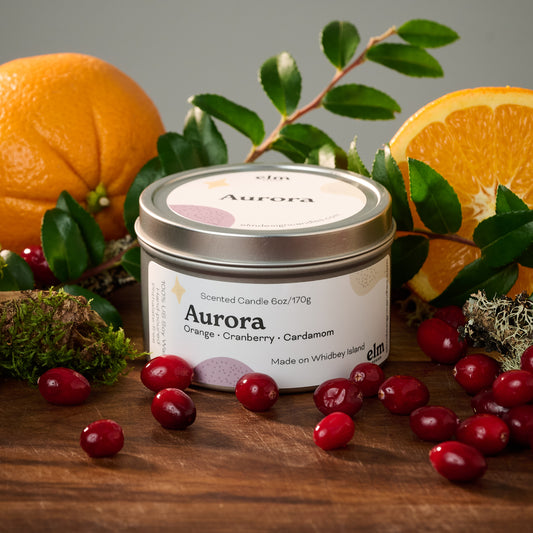 Elm Design's scented candle "Aurora" in a 6oz metal tin.