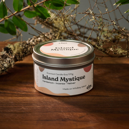 Elm Design's scented candle "Island Mystique" in a 6oz metal tin.