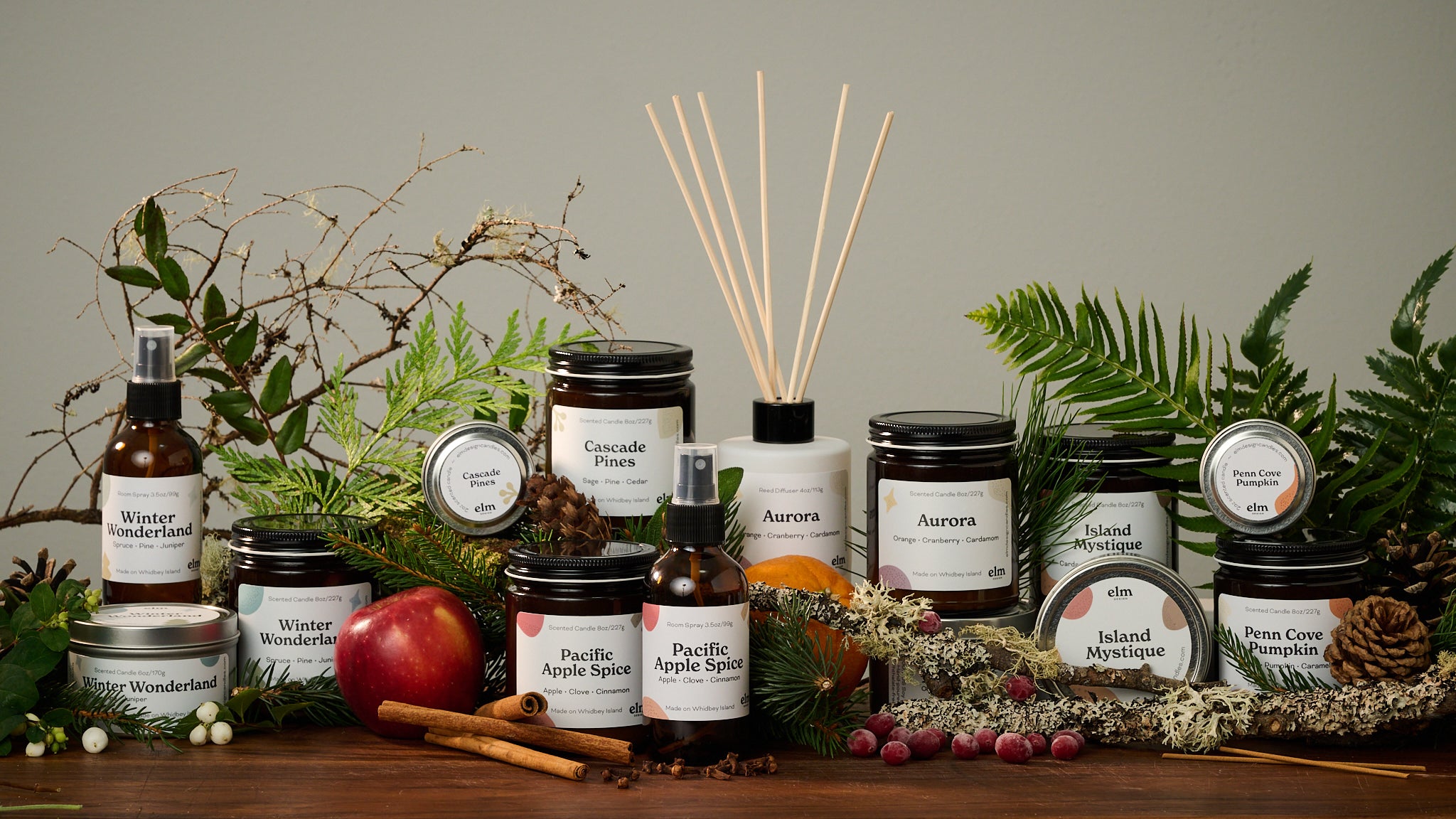 Candles and other products sitting with seasonal flora and fauna