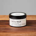 Load image into Gallery viewer, Snowy Bluff scented soy candle in black matte metal tin. 6oz size
