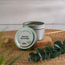 Load image into Gallery viewer, Matcha Mornings scented soy candle in colorfully labeled 2 oz container.
