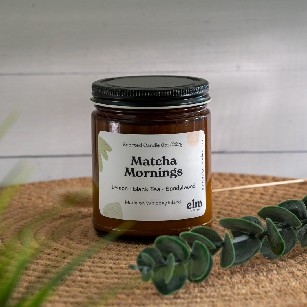 Matcha Mornings scented soy candle in colorfully labeled 8 oz container.