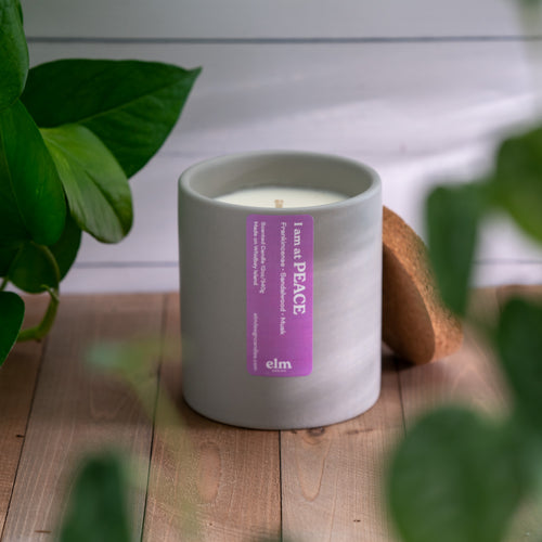 Elm Design's 12 ounce soy candle in our PEACE scent.