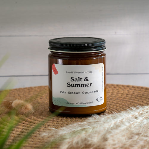 Salt & Summer scented soy candle in colorfully labeled 8 oz container.
