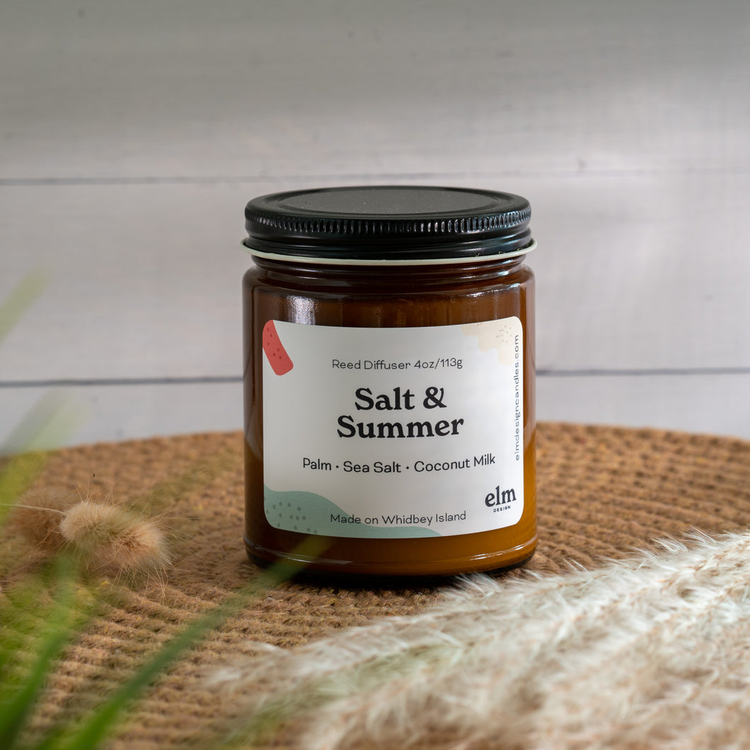Salt & Summer scented soy candle in colorfully labeled 8 oz container.