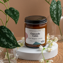 Load image into Gallery viewer, Cascade Calm scented soy candle in colorfully labeled 8 oz container.
