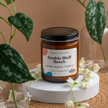 Load image into Gallery viewer, Double Bluff Beach scented soy candle in colorfully labeled 8 oz container.
