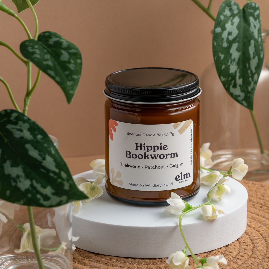 Hippie Bookworm scented soy candle in colorfully labeled 8 oz container.