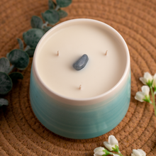 Load image into Gallery viewer, 20oz Throat Chakra scented soy candle, in a hand crafted teal Briggs Shore ceramic vessel. 

