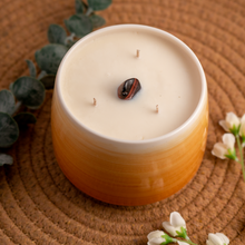 Load image into Gallery viewer, 20oz Sacral Chakra scented soy candle, in a hand crafted orange Briggs Shore ceramic vessel.
