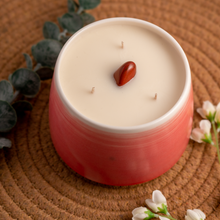 Load image into Gallery viewer, 20oz Root Chakra scented soy candle, in a hand crafted red Briggs Shore ceramic vessel.
