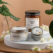 Load image into Gallery viewer, Salish Sea scented soy candles in colorfully labeled 8, 6 and 2 oz containers.

