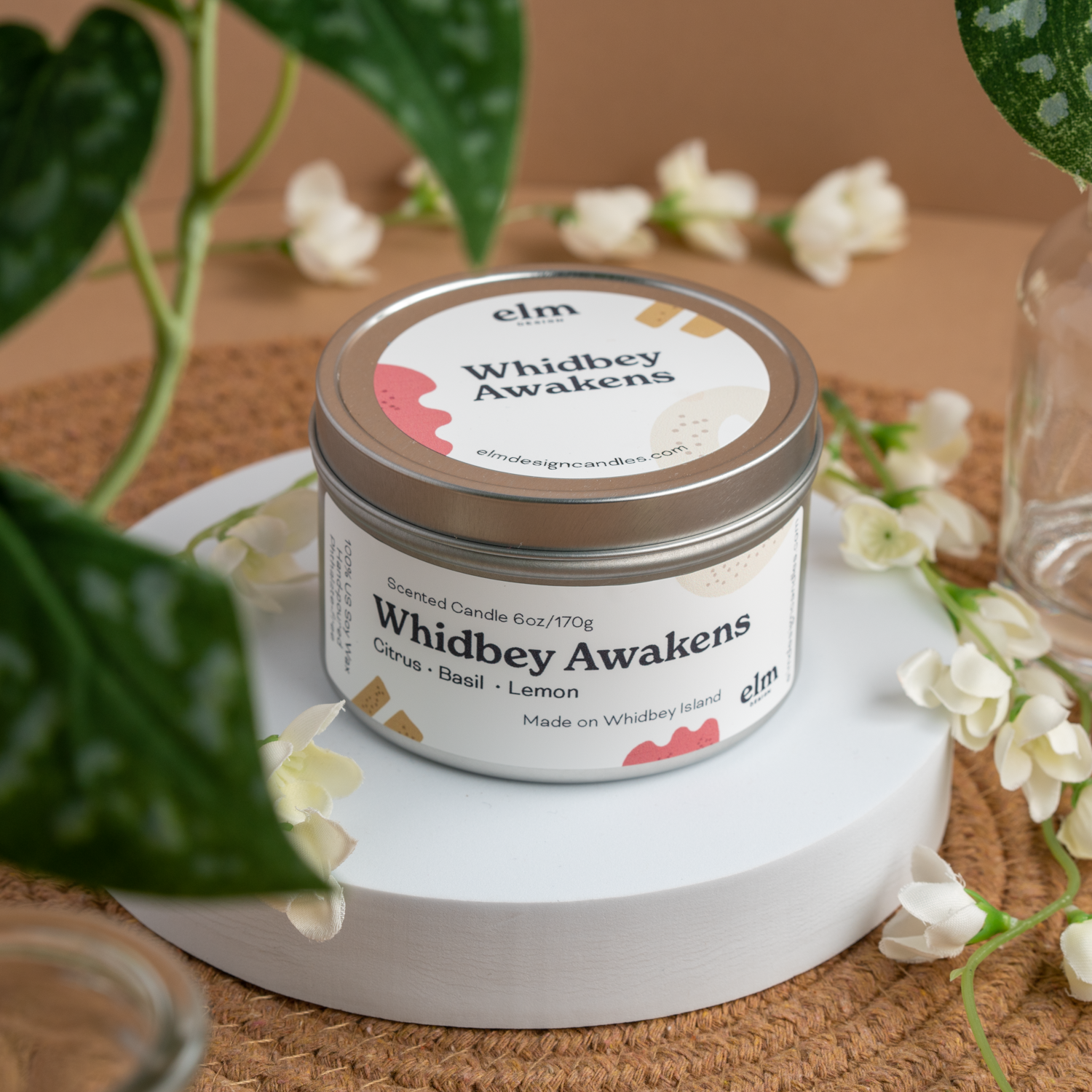 Whidbey Awakens scented soy candle in colorfully labeled 6 oz container.