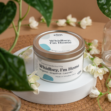 Load image into Gallery viewer, Whidbey, I&#39;m Home scented soy candle in colorfully labeled 6 oz container.
