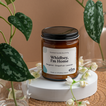 Load image into Gallery viewer, Whidbey, I&#39;m Home scented soy candle in colorfully labeled 8 oz container.
