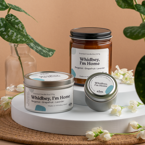 Whidbey, I'm Home scented soy candles in colorfully labeled 8, 6 and 2 oz containers.