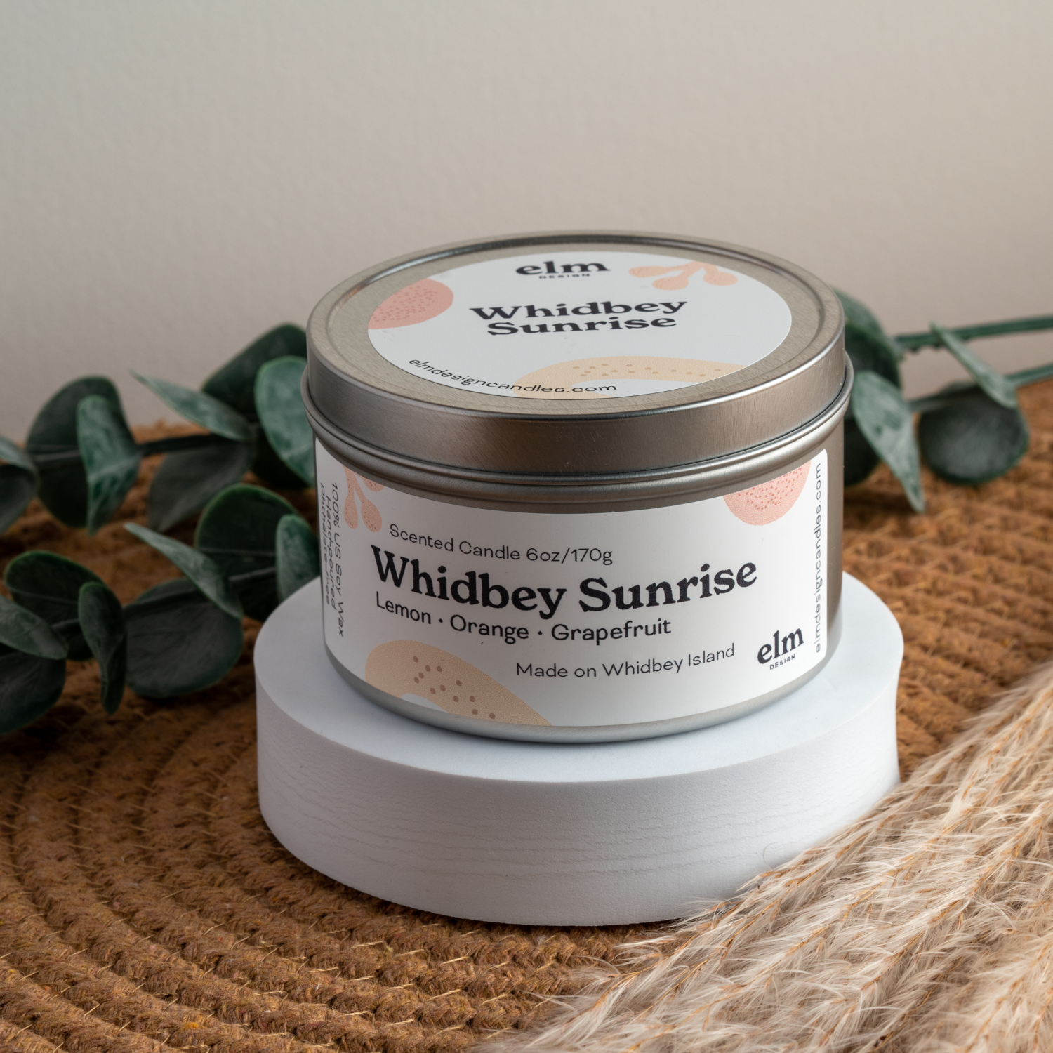 Whidbey Sunrise scented soy candle in colorfully labeled 6 oz container.