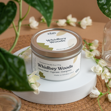 Load image into Gallery viewer, Whidbey Woods scented soy candle in colorfully labeled 6 oz container.
