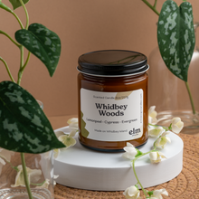 Load image into Gallery viewer, Whidbey Woods scented soy candle in colorfully labeled 8 oz container.
